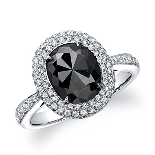 A single rose cut oval shaped black diamond weighting 3.69 ct, sits surrounded by a halo of 116 sparkling white diamonds totaling 0.52 ctw. in this unique 14k white gold black diamond ring. This fabulous look is the latest trend worn by many celebrities.